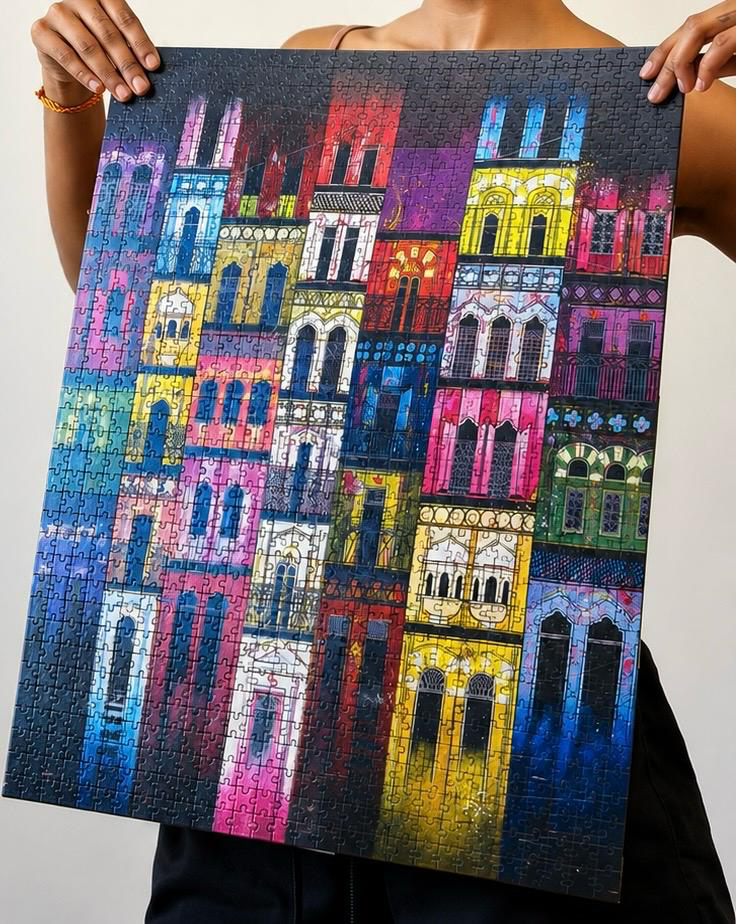 Sushmita holding a colorful building-facade jigsaw puzzle